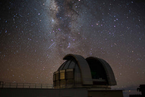 Telescope gazes at a star filled sky